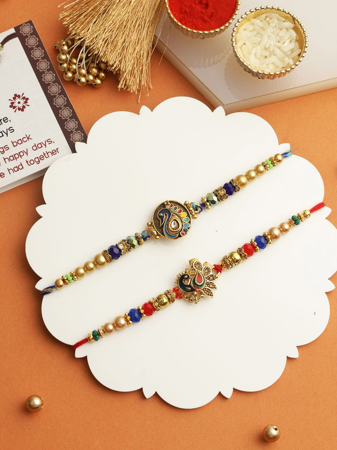 

TIED RIBBONS Set of 2 Peacock Brother Rakhi with Card & Roli Chawal, Red