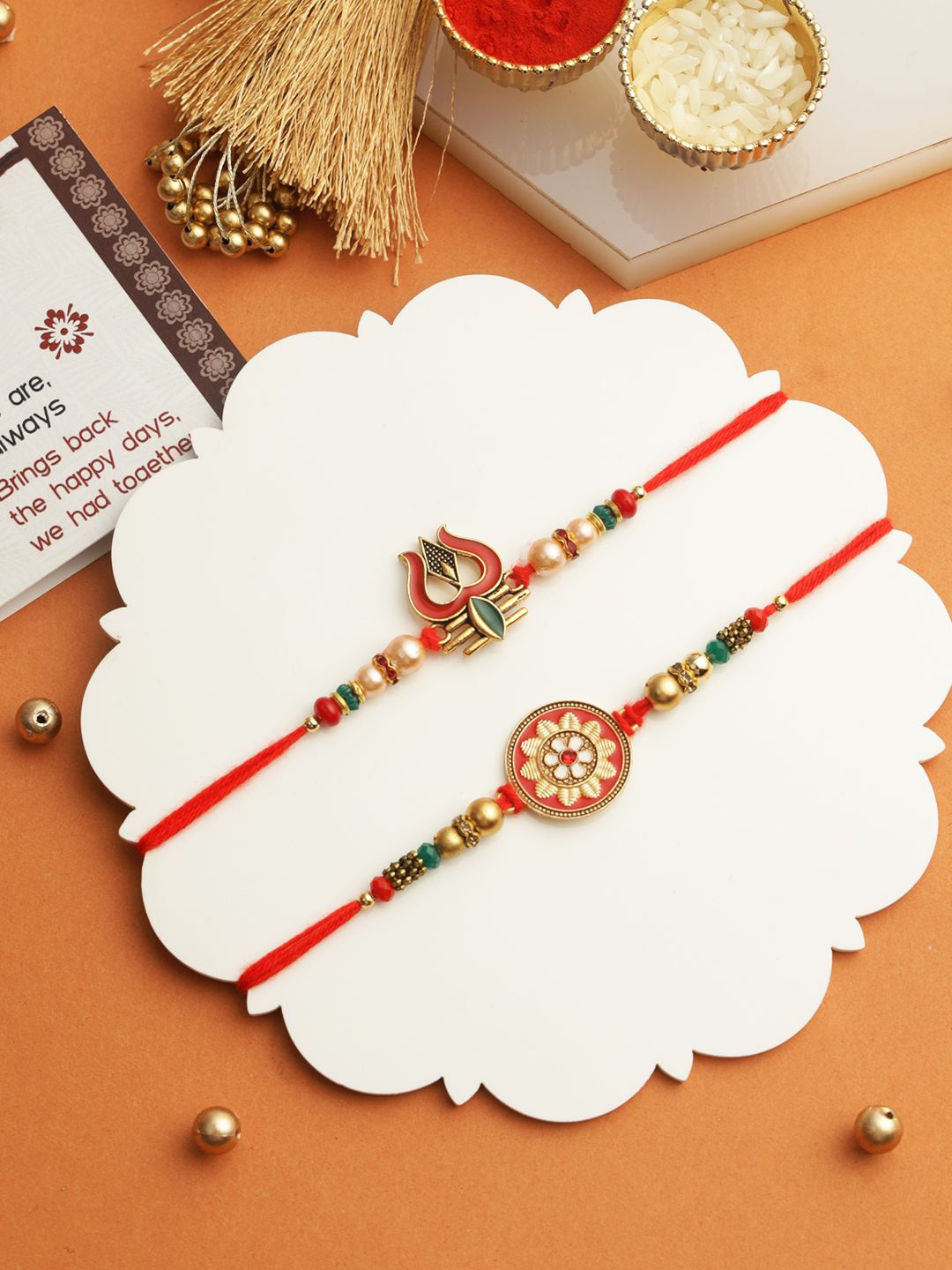 

TIED RIBBONS Set of 2 Trishul Rakhi with Greeting Card & Roli Chawal, Gold