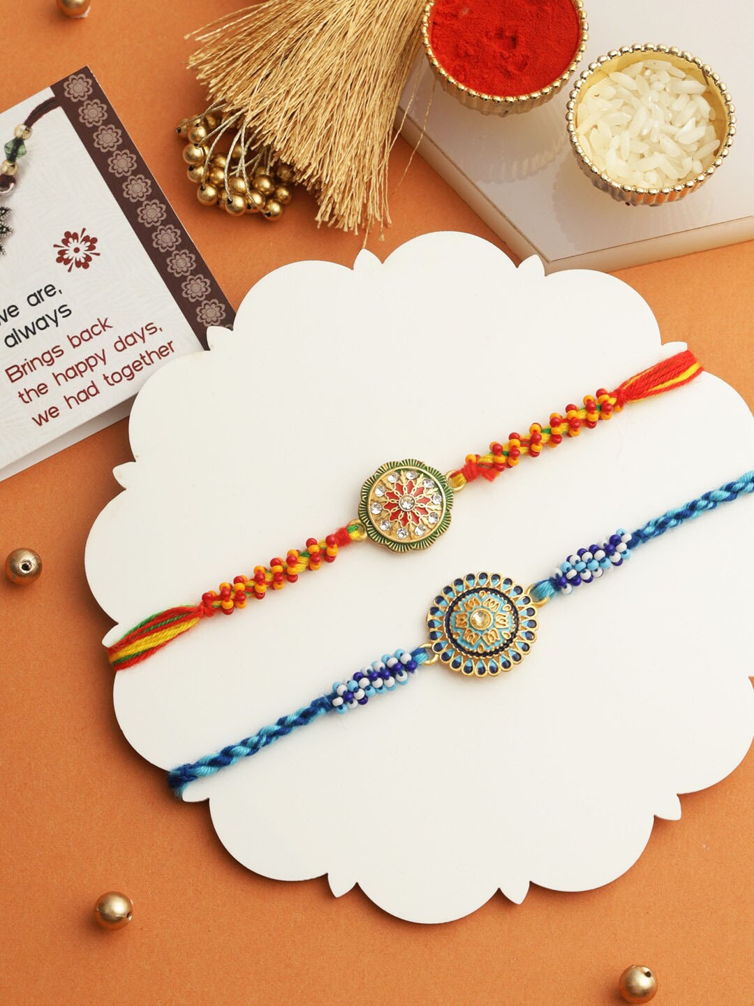 

TIED RIBBONS Set of 2 Pearl Rakhi with Greeting Card & Roli Chawal Combo, Red