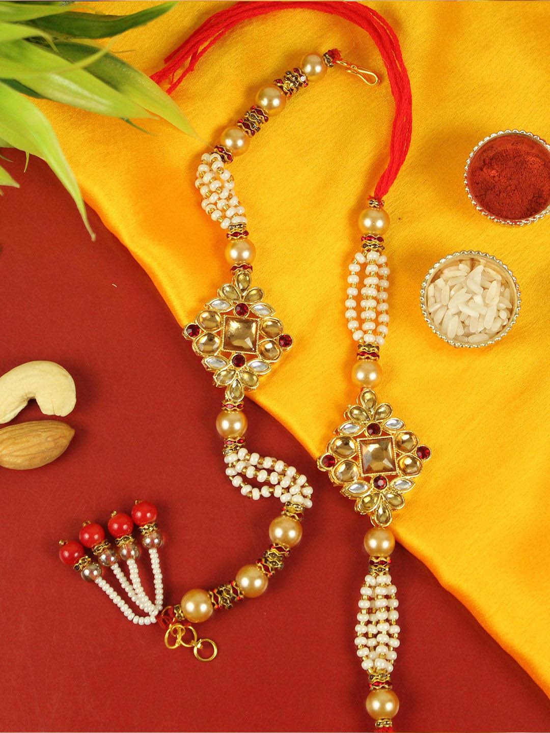 

TIED RIBBONS Set of 2 Bhaiya Bhabhi Bracelet Rakhi, Card & Roli Chawal Combo, Red