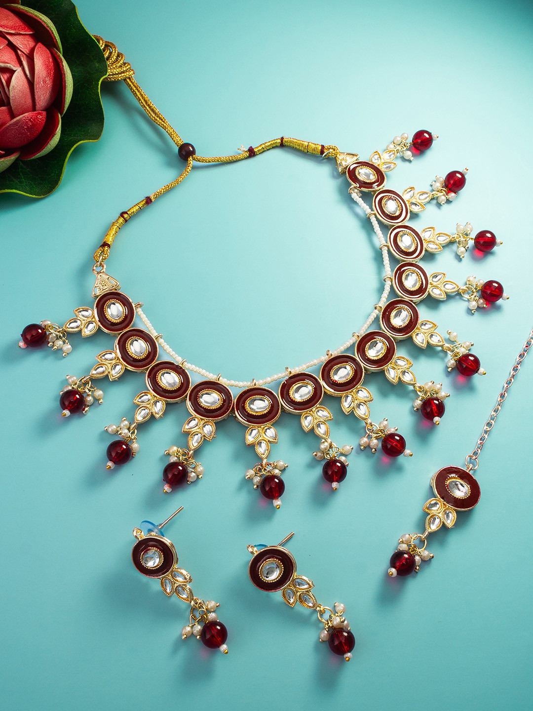 

aadita Gold-Plated Stone-Studded & Beaded Jewellery Set