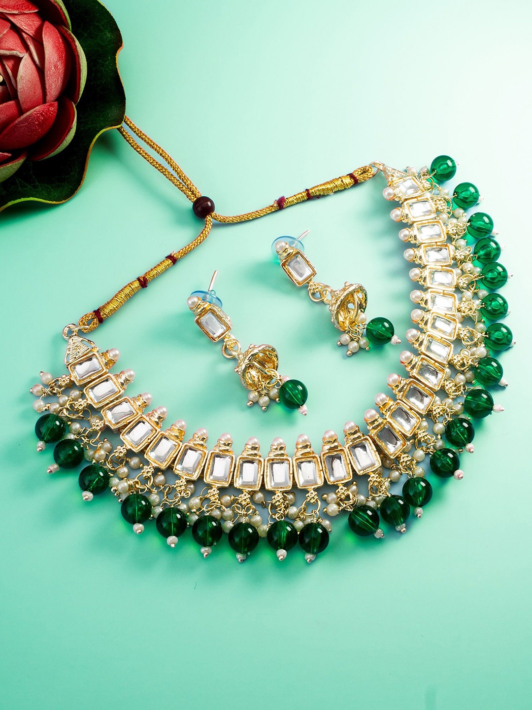 

aadita Gold-Plated Stone-Studded & Beaded Jewellery Set