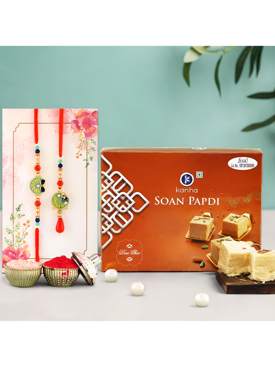 

Ascension Set of 2 Rakhi With Soanpapdi Sweet (200gm) & Greeting Card With Roli Chawal, Red