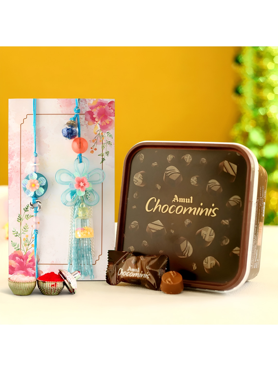 

Ascension Set of 2 Rakhi With Choco Minis Chocolate & Greeting Card With Roli Chawal, Blue