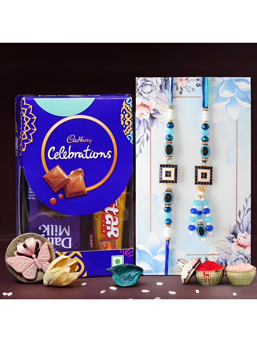 

Ascension Set Of 2 Bhaiya Bhabhi Rakhis With Celebration Pack & Rholi Chawal, Blue