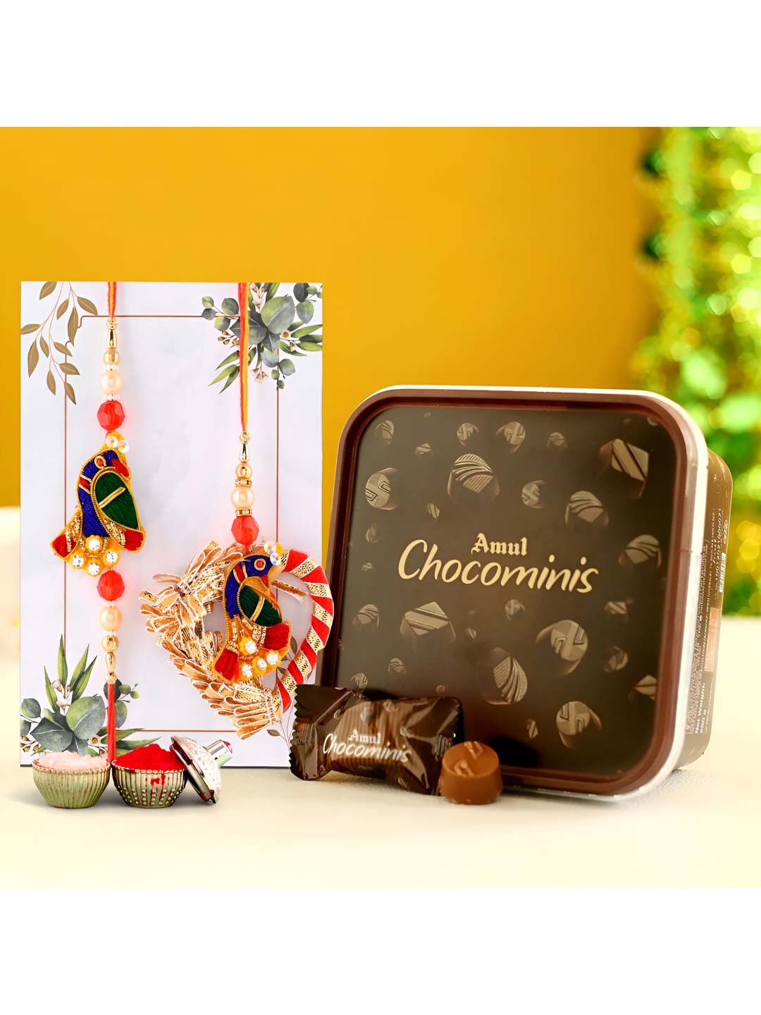 

Ascension Set of 2 Rakhi With Choco Minis Chocolate & Greeting Card With Roli Chawal, Red