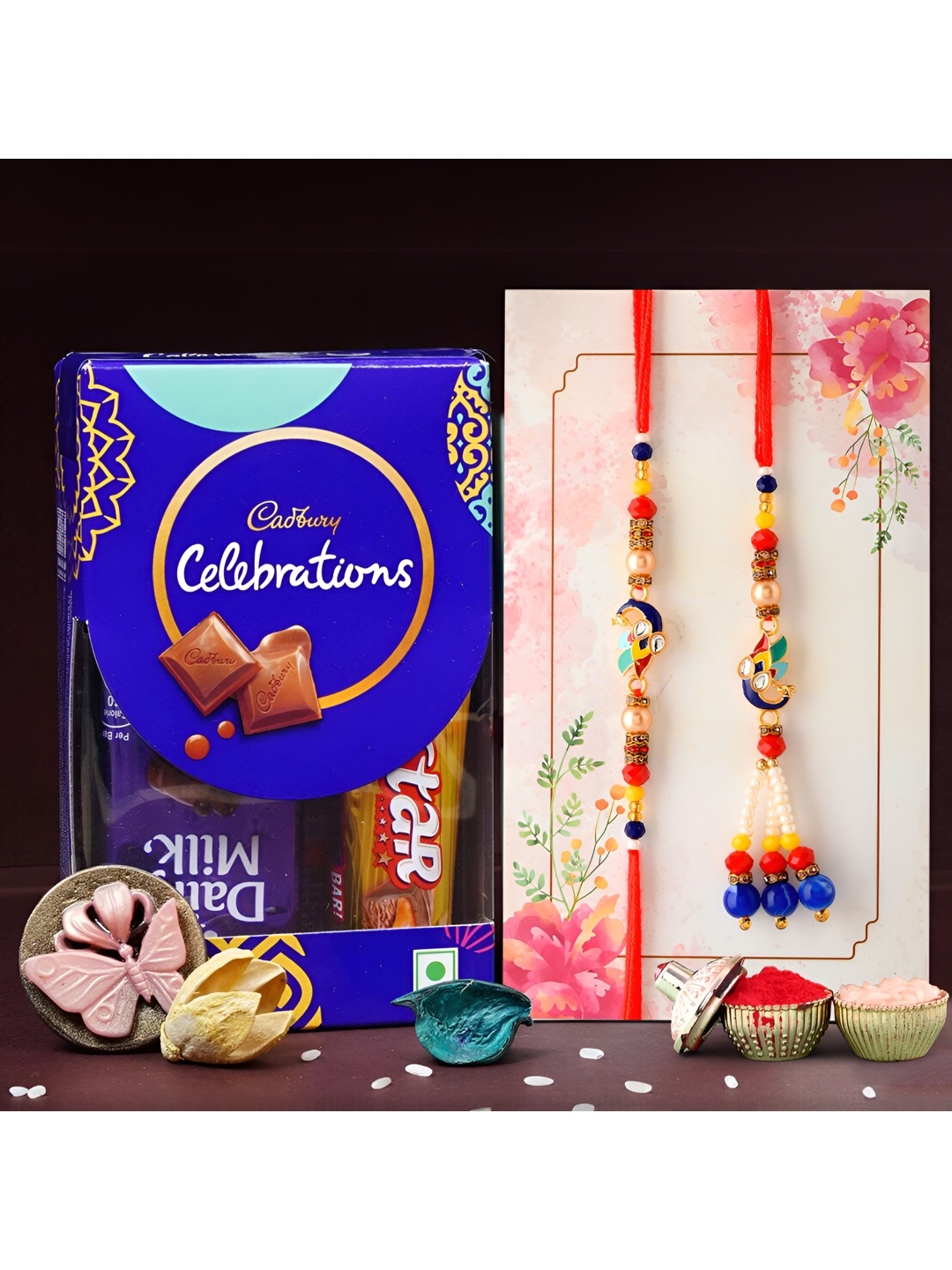 

Ascension Set of 2 Rakhi With Celebration Chocolates & Greeting Card With Roli Chawal, Red