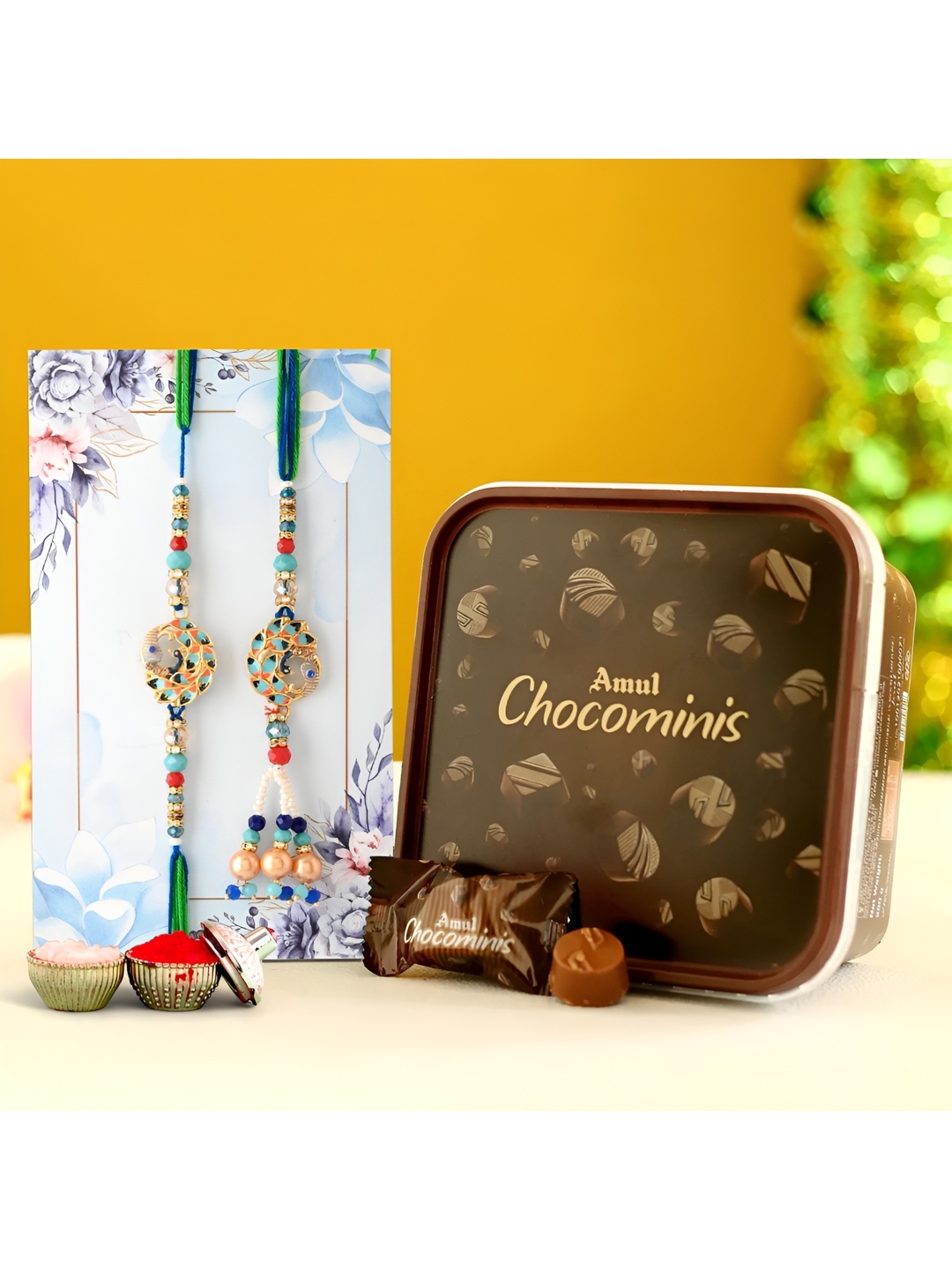 

Ascension Set of 2 Rakhi With Choco Minis Chocolate & Greeting Card With Roli Chawal, Blue