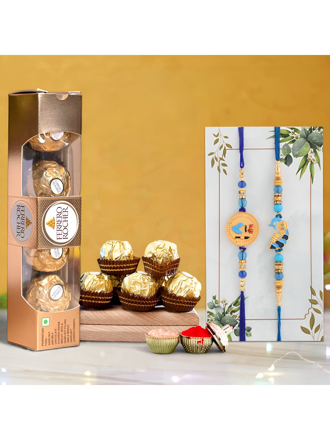 

Ascension Set Of 2 Rakhi With Ferrero Rocher Chocolates & Rholi Chawal, Blue