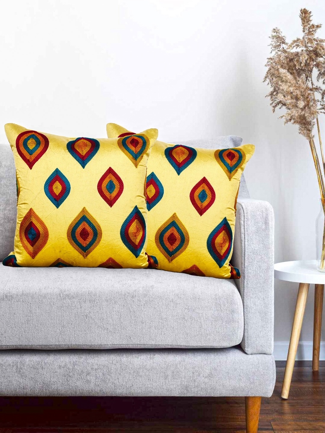 

Vinayaka Fab Gold-Toned & Green 2 Pieces Geometric Embroidered Square Cushion Covers