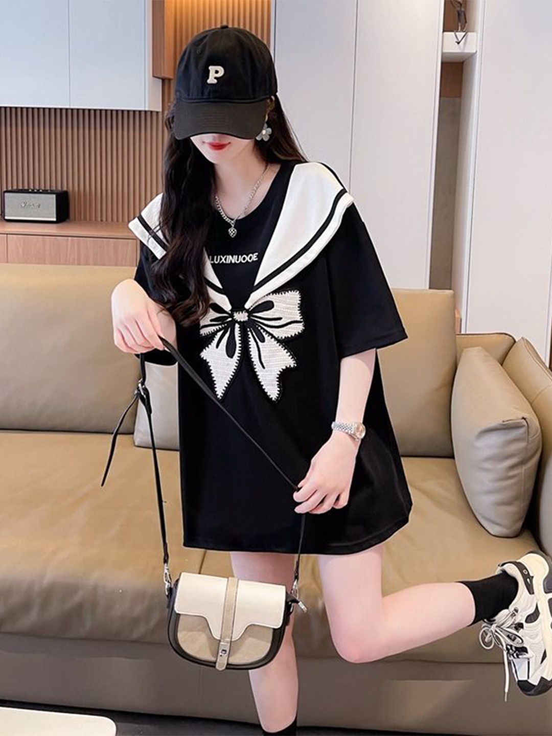 

StyleCast x Revolte Bow Embroidered Graphic Monochrome Round Neck Top, Black