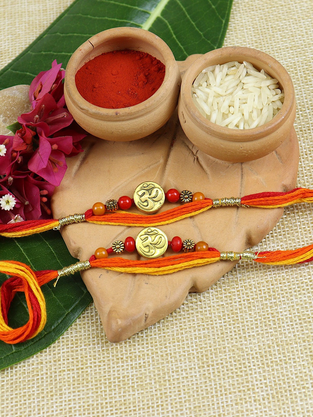 

Asthetika Set of 2 OM Rakhis With Roli Chawal, Orange