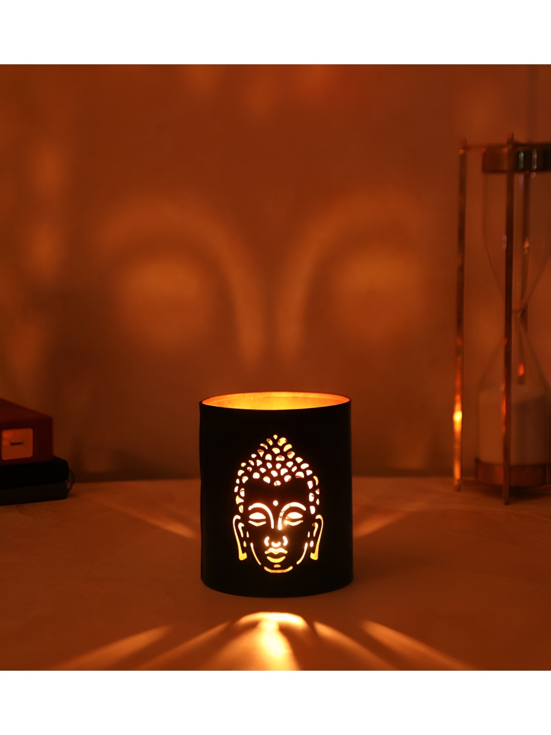 

THE HOME CO. Black buddha Cut Metal Candle Holder