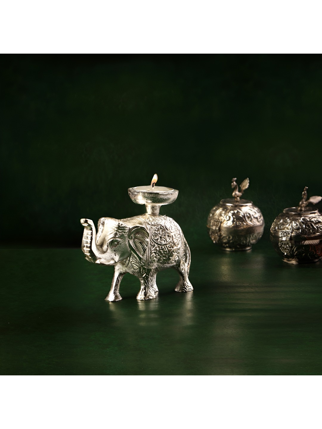 

THE HOME CO. Silver-Toned Elephant Candle Holder