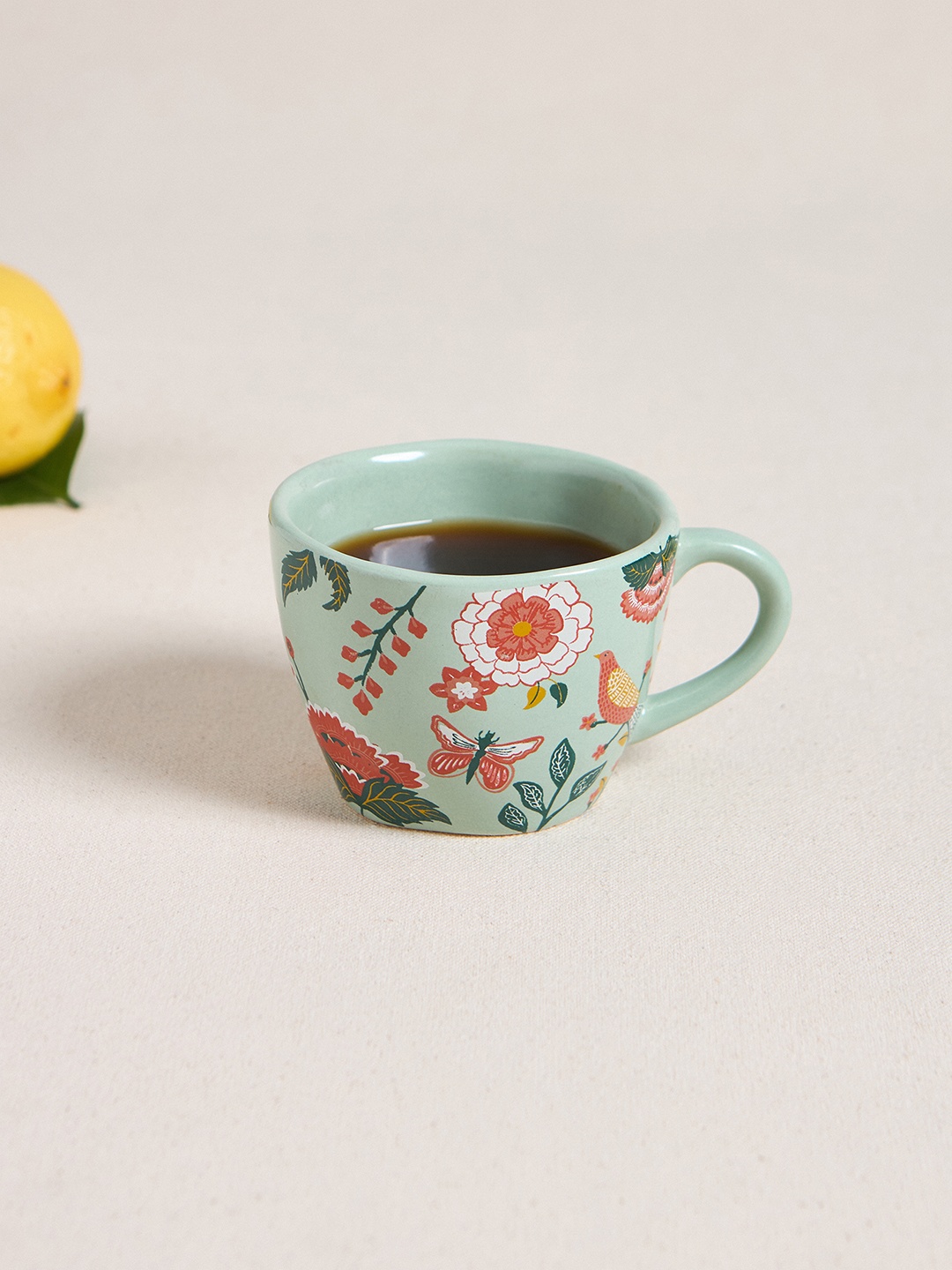 

Chumbak Sea Green & Red Floral Printed Ceramic Glossy Cup 150 ml