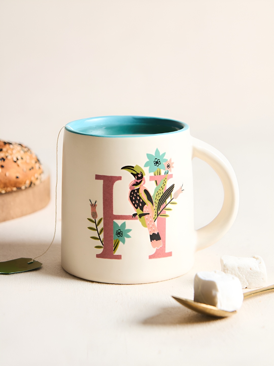 

Chumbak Off White & Blue Printed Ceramic Glossy Mug 300 ml