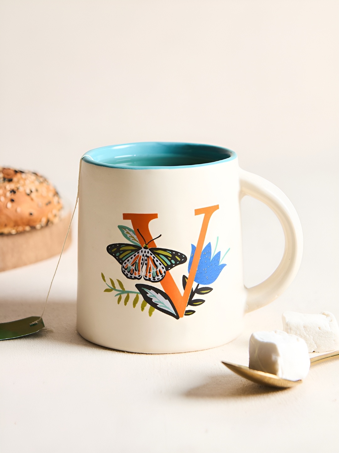 

Chumbak Off White & Orange Printed Ceramic Glossy Mug 300 ml