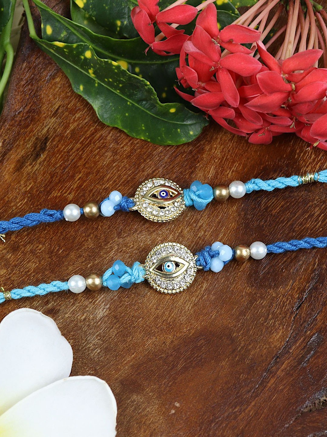 

Asthetika Set of 2 Beaded Thread Rakhis with Greeting Card & Roli Chawal, Blue