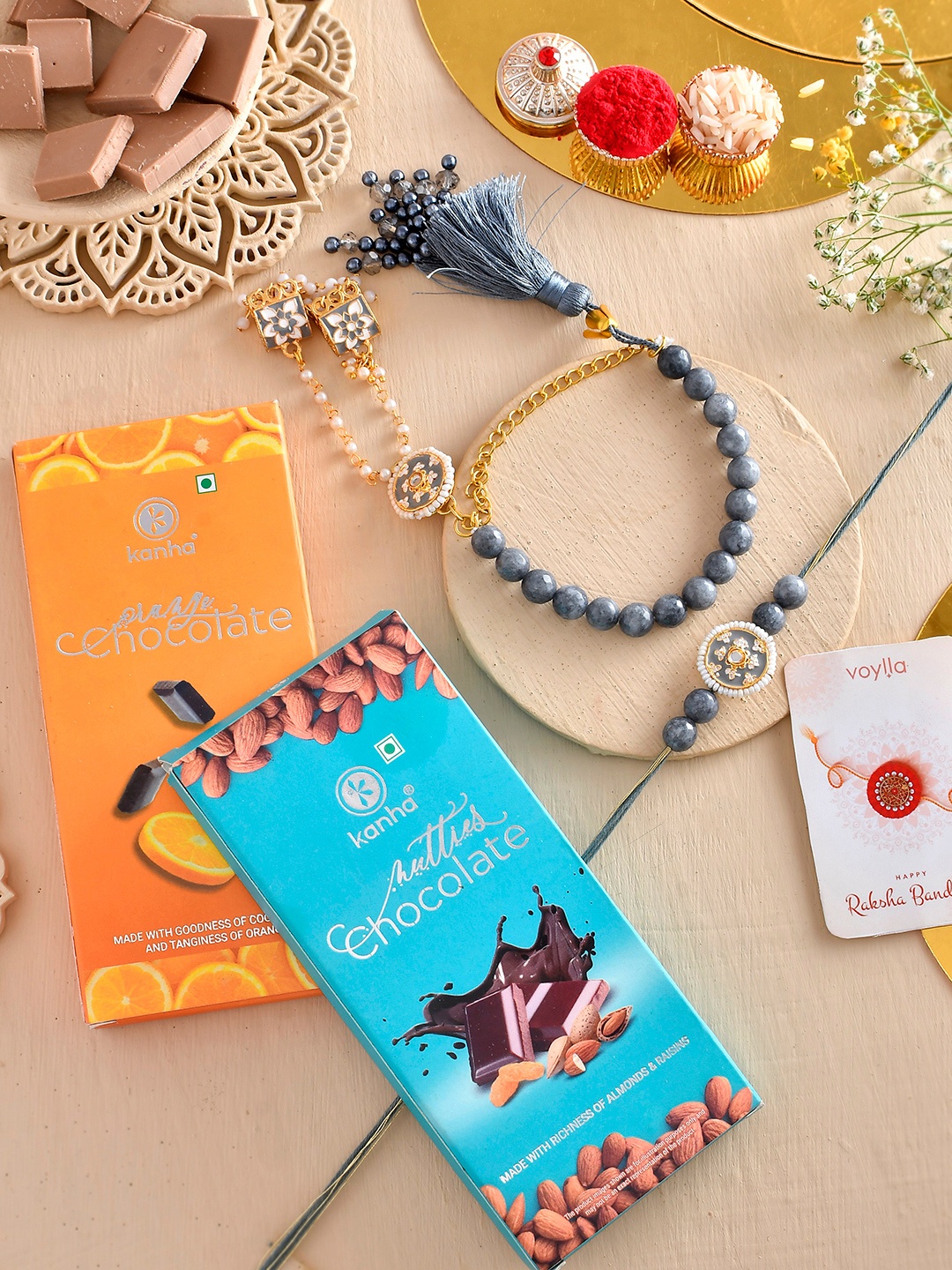 

Voylla Set Of 4 Rakhi with Orange And Nutty Chocolate Bar, Blue