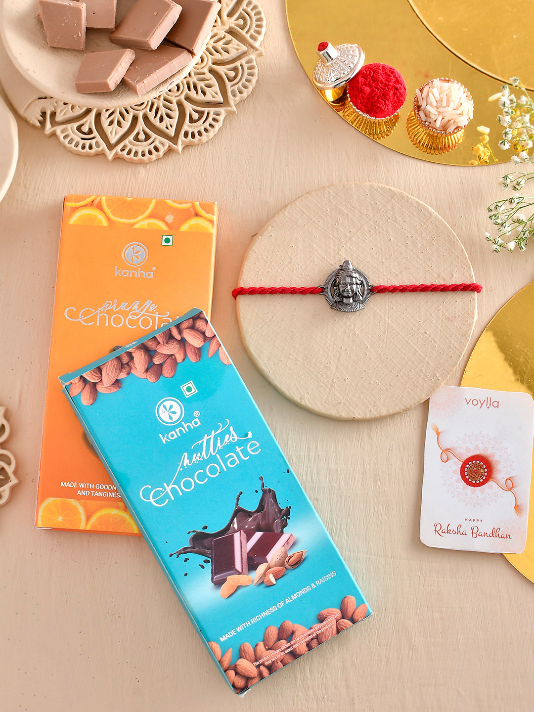 

Voylla Set Of 3 Rakhi with Orange And Nutty Chocolate Bar, Blue