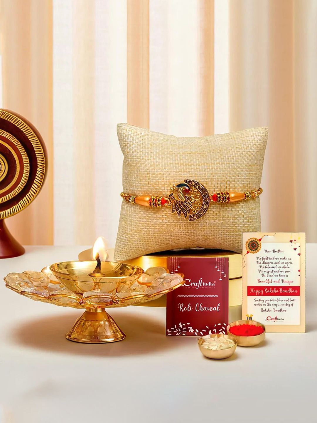 

eCraftIndia Designer Peacock Rakhi & Crystal Brass Diya, Gold