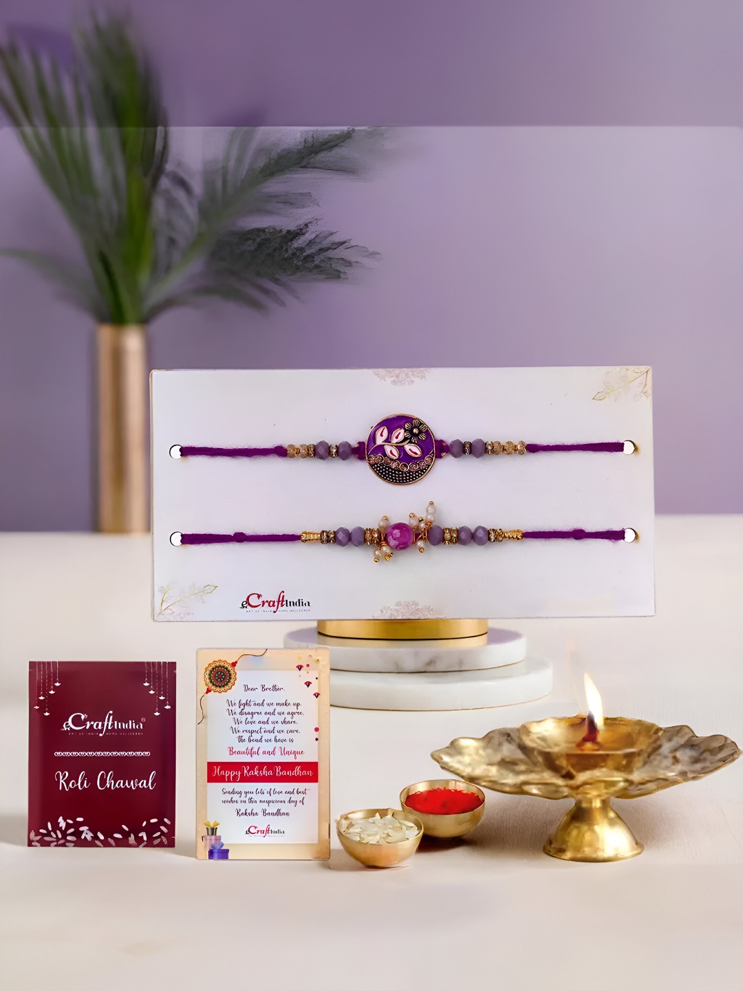 

eCraftIndia Set Of 3 Floral Rakhis With Crystal Diya & Greeting Card With Roli Chawal, Red