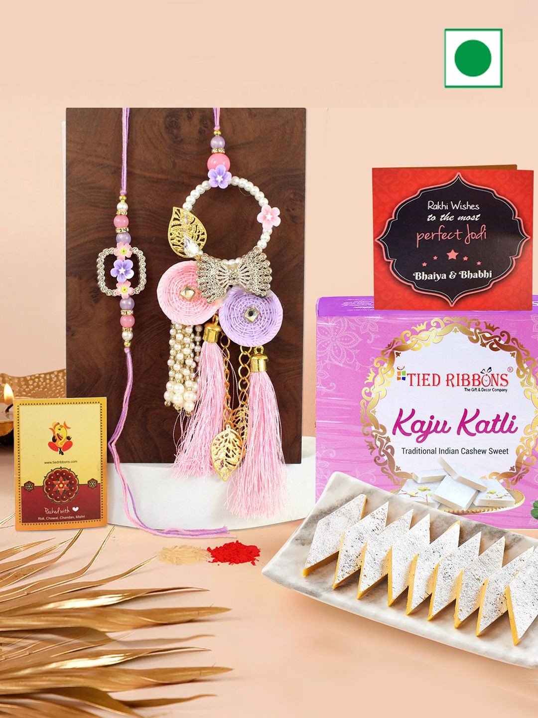 

TIED RIBBONS Set of 2 Bhaiya Bhabhi Rakhis & Mini Card and Roli Chawal with Sweets Gifts, Pink