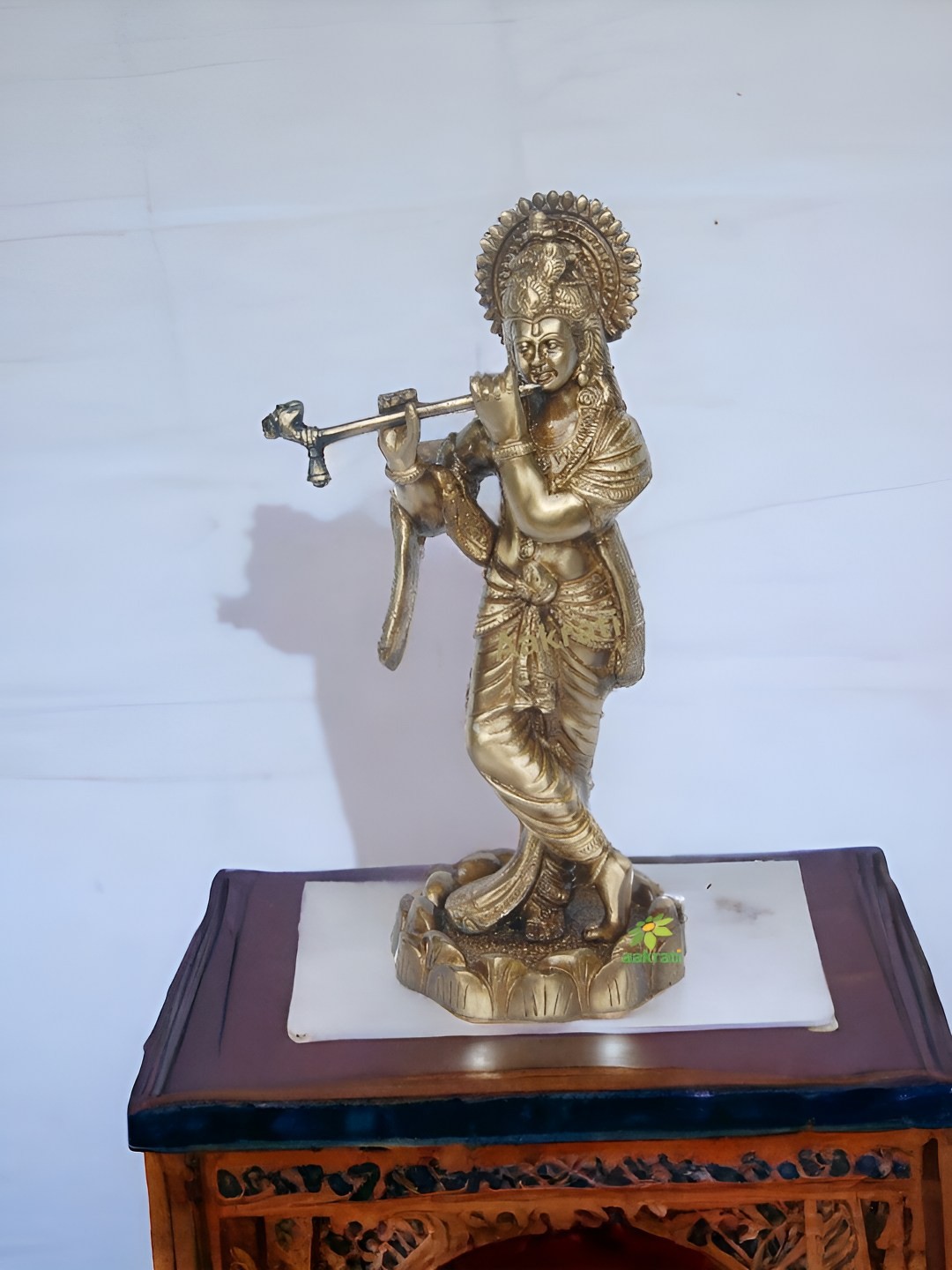 

Aakrati Gold-Toned & White Religious Lord Krishna Idol Showpiece