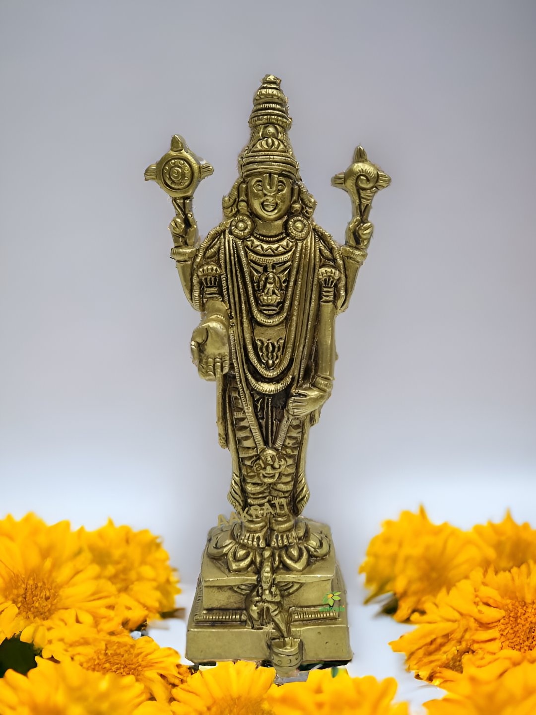 

Aakrati Yellow & Black Brass Religious Idol Showpiece