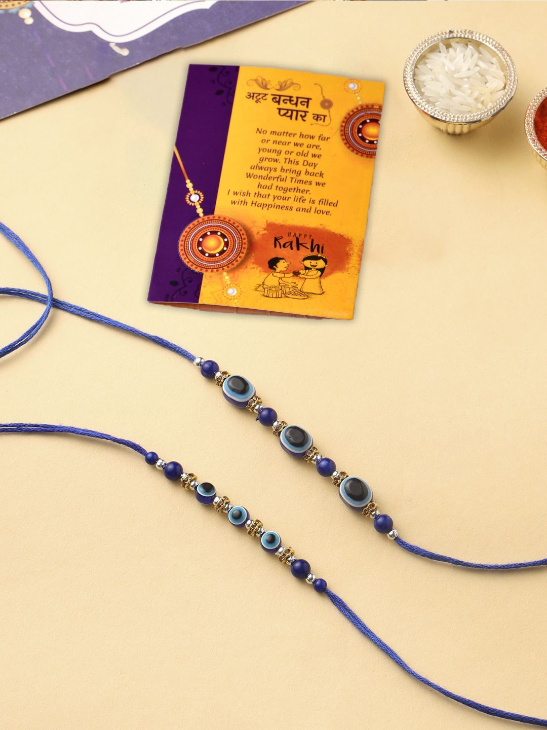 

CraftVatika Set of 2 Beaded Thread Rakhis with Greeting Card, Blue