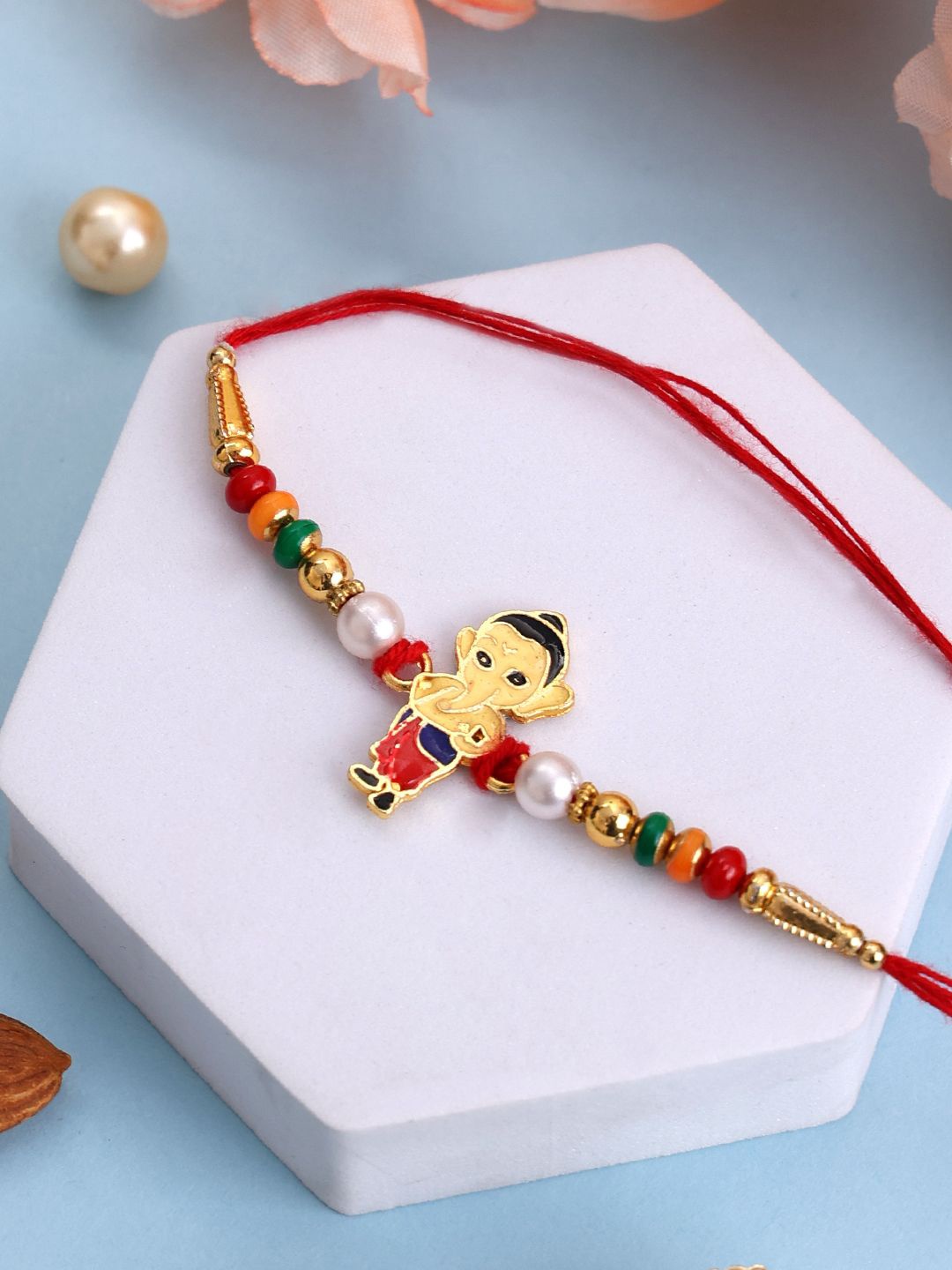 

PANASH Gold-Plated Ganesh Shaped Beaded With Thread Rakhi With Roli Chawal
