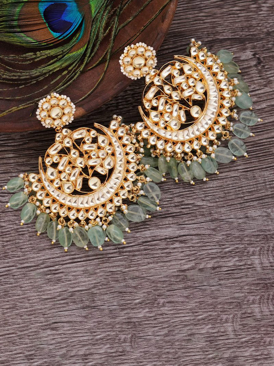 

AURAA TRENDS Gold Plated Kundan Contemporary Chandbalis