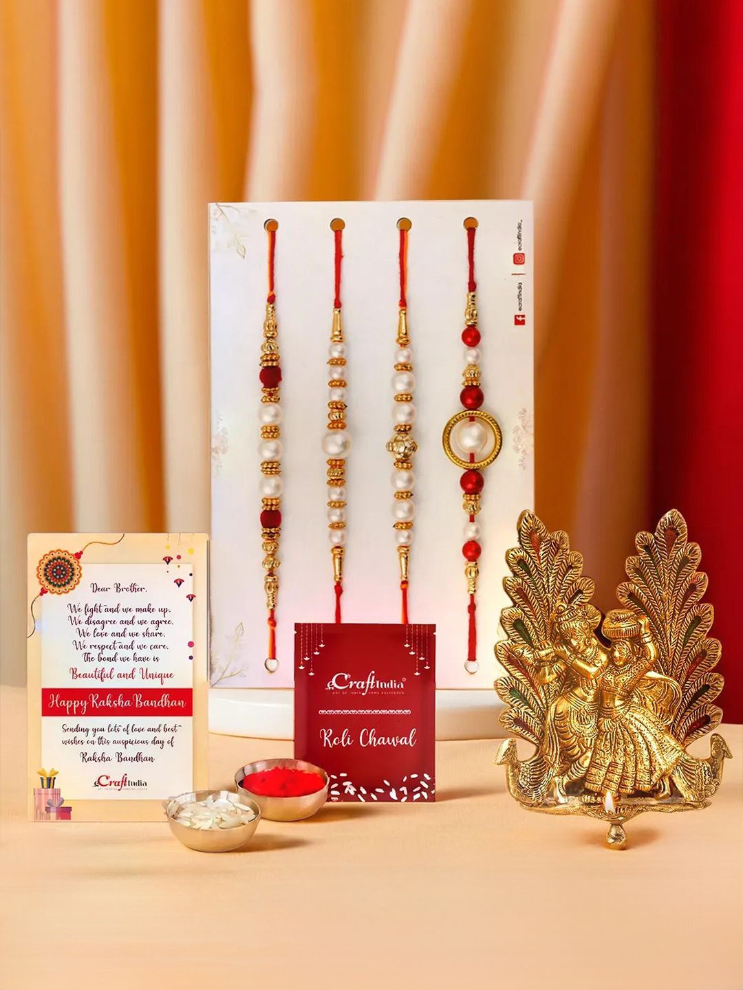 

eCraftIndia Set of 5 Rakhis with Radha Krishna Idol Diya & Roli Chawal, Red