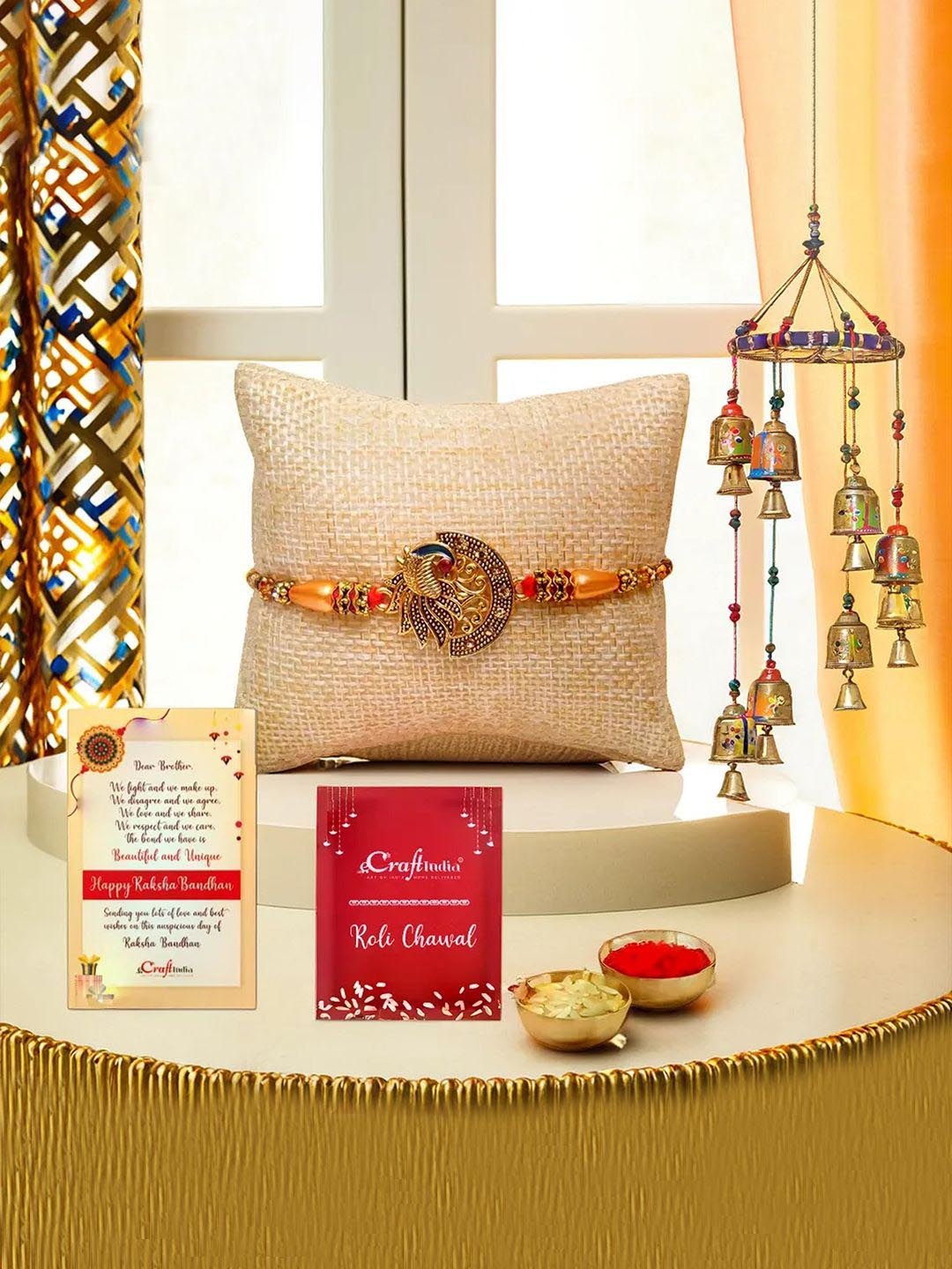 

eCraftIndia Set Of 2 Peacock Rakhi With Hanging Bells & Rholi Chawal, Gold