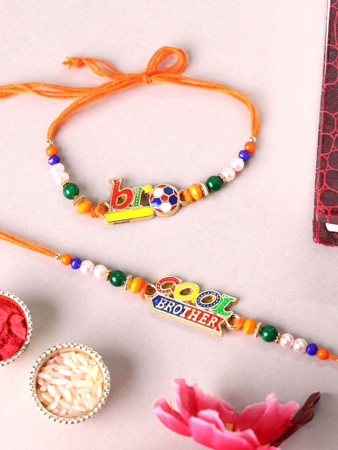 

PANASH Set Of 2 Gold Plated Name Of Bro & Cool Brother Rakhis With Roli Chawal
