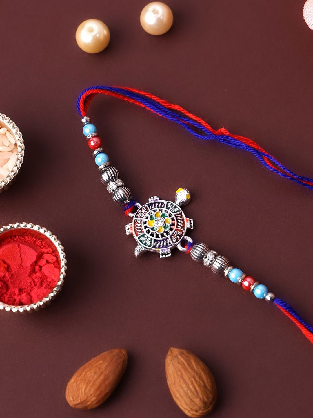 

PANASH Silver-Plated Tortoise Shaped Thread Rakhi With Roli Chawal