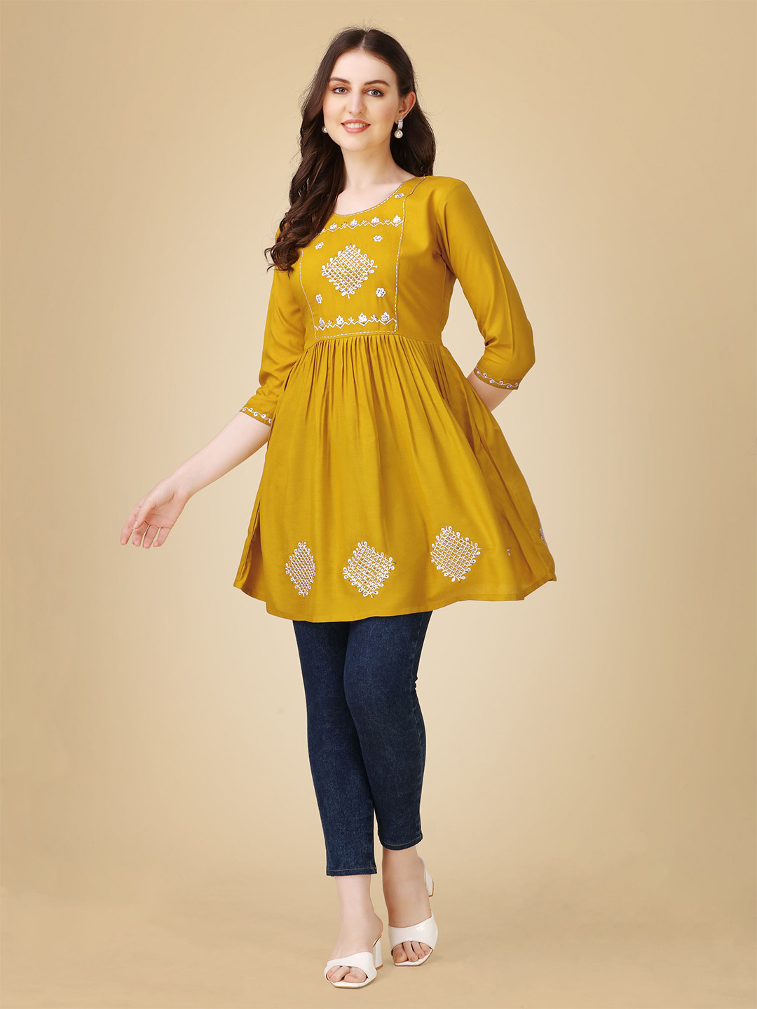 

Rujave Women Ethnic Motifs Embroidered A-Line Top, Mustard