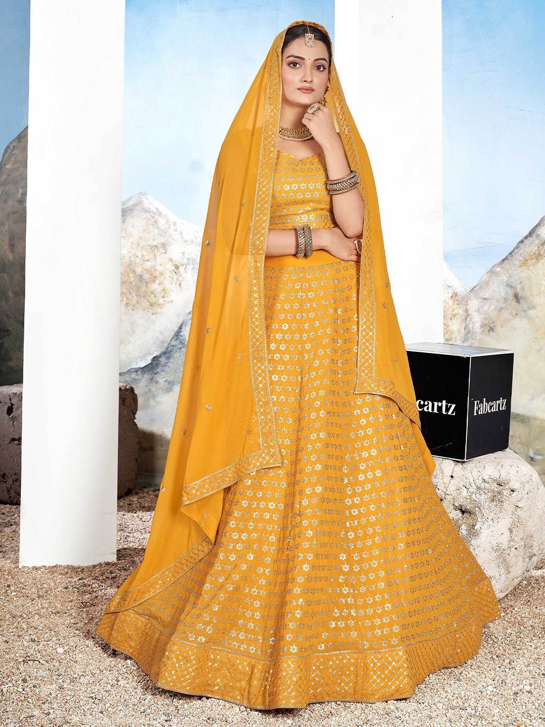 

Fabcartz Pure Georgette Sequinned Semi-Stitched Lehenga & Unstitched Blouse & Dupatta, Yellow