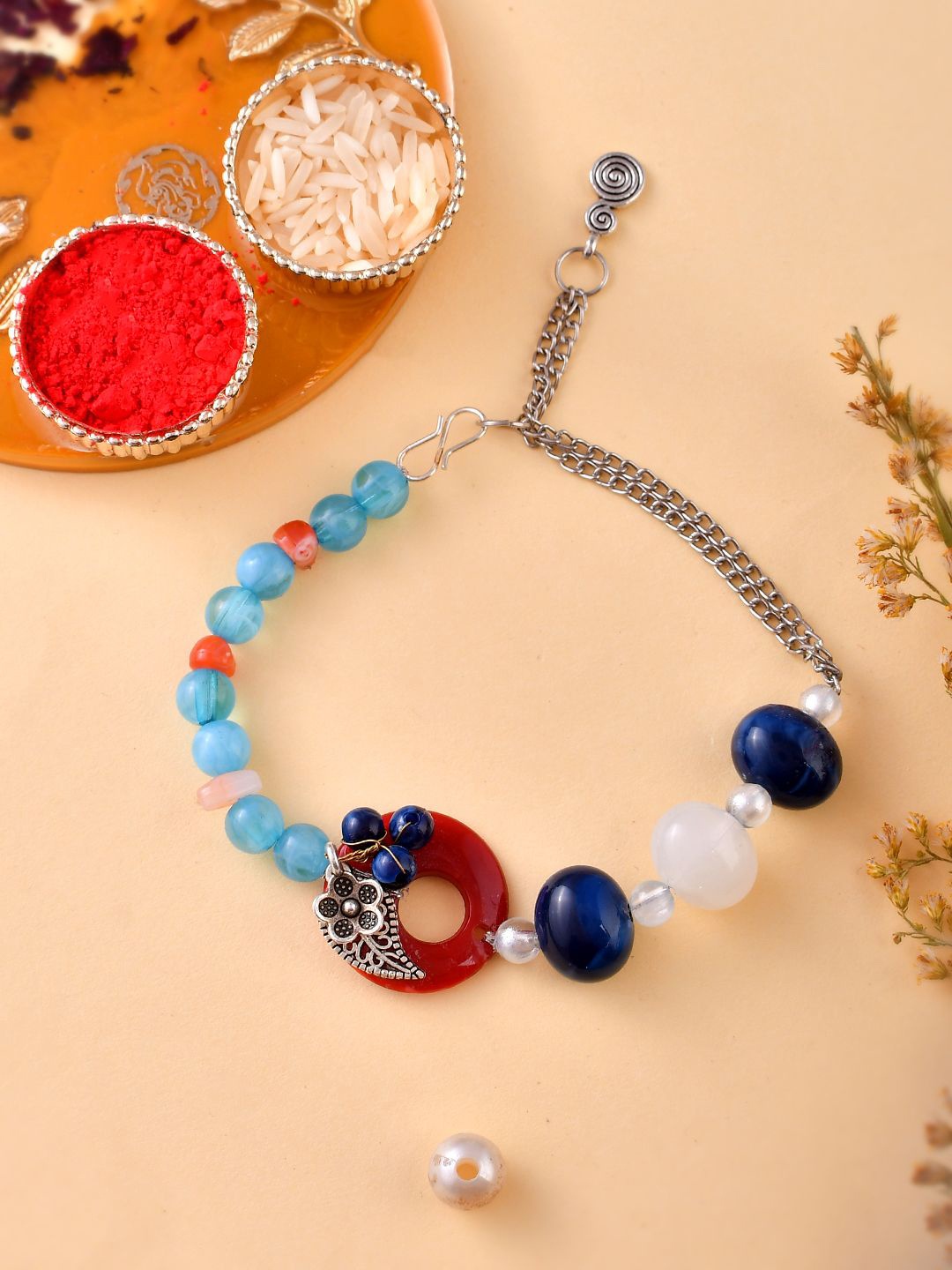 

Aapno Rajasthan Beaded Bracelet Rakhi With Rholi Chawal & Greeting Card, Silver