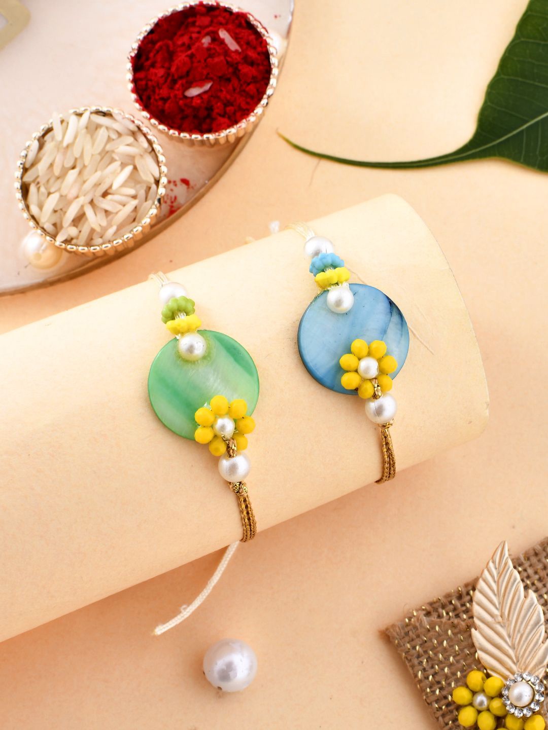 

Aapno Rajasthan Set Of 2 Beaded Rakhis With Roli Chawal & Greeting Card, Green