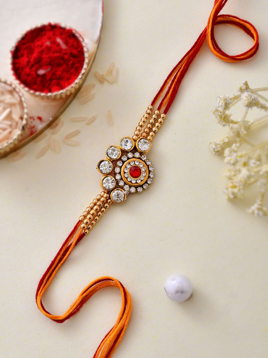 

Aapno Rajasthan Kundan & Beaded Rakhi With Rholi Chawal & Greeting Card, Gold