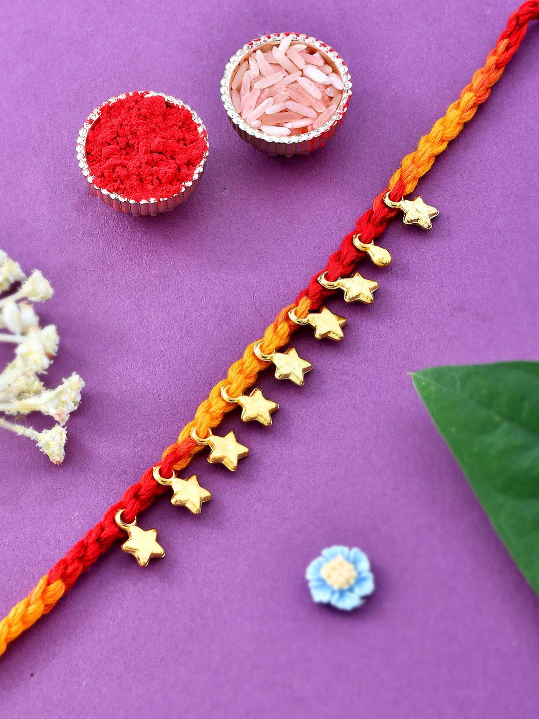 

Aapno Rajasthan Golden Star Woven Sparkling Rakhi With Rholi Chawal & Greeting Card, Gold