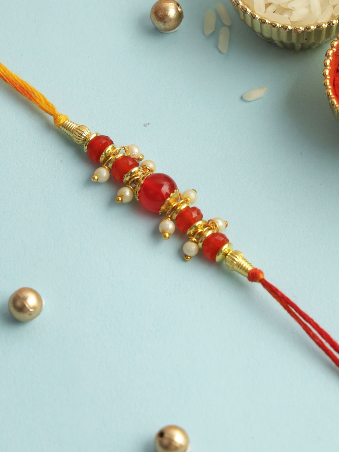 

Aapno Rajasthan Beaded Rakhi With Roli Chawal & Greeting Card, Red