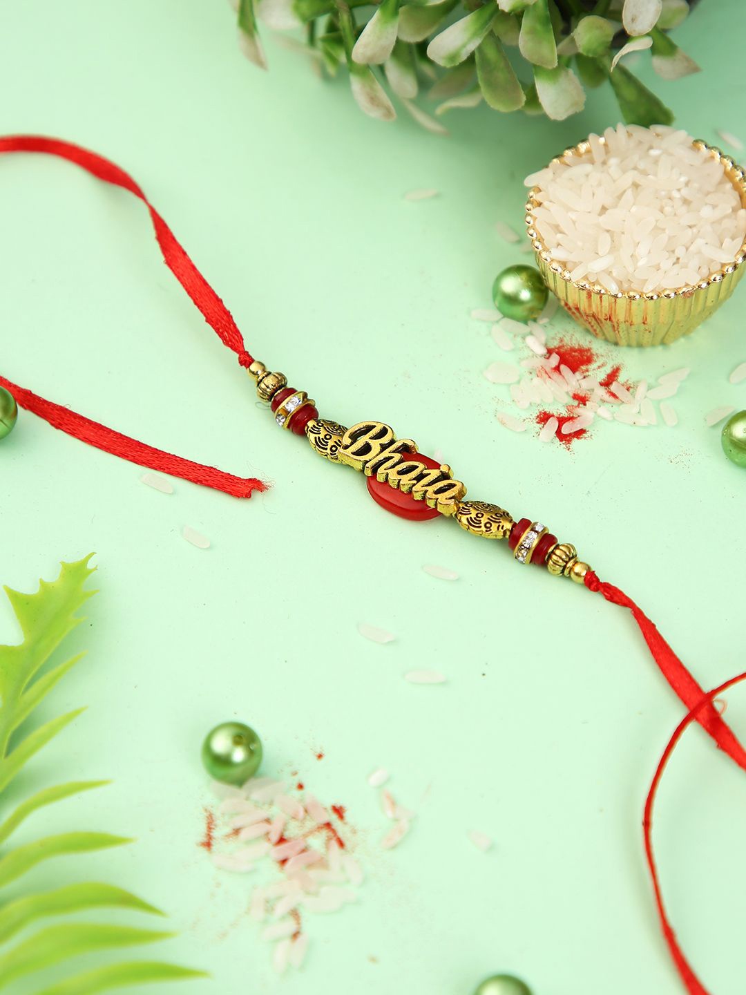 

Aapno Rajasthan Beaded & Stone Studed Rakhi With Roli Chawal & Greeting Card, Gold