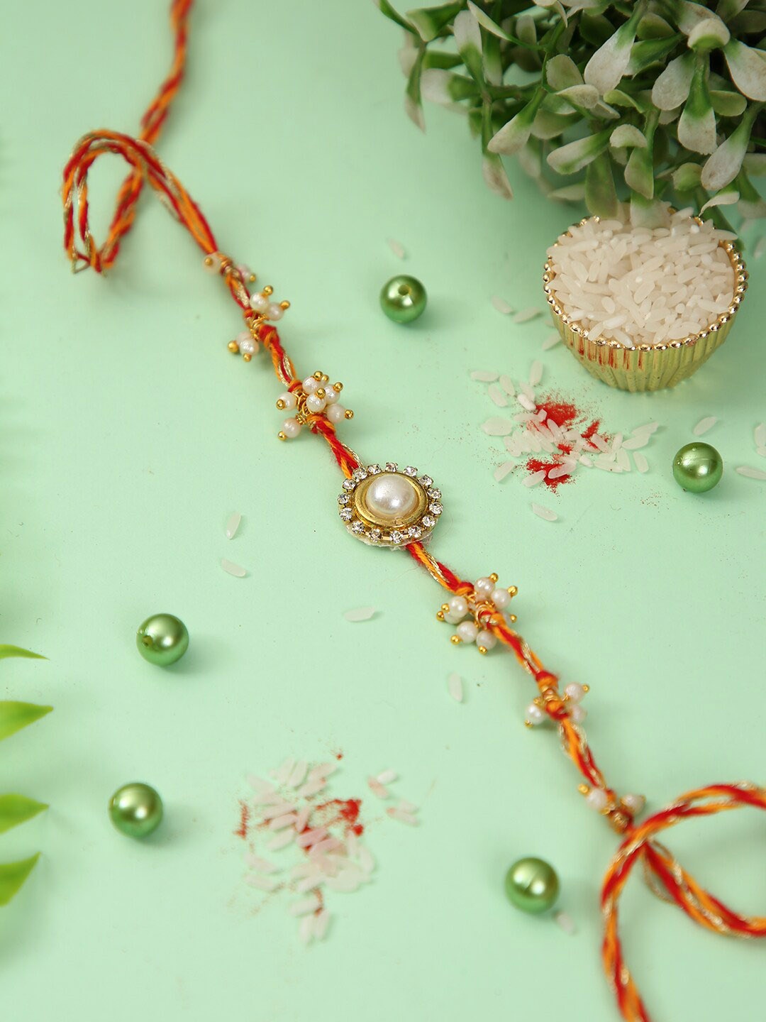 

Aapno Rajasthan Stone Studded & Beaded Rakhi With Roli Chawal & Greeting Card, Cream