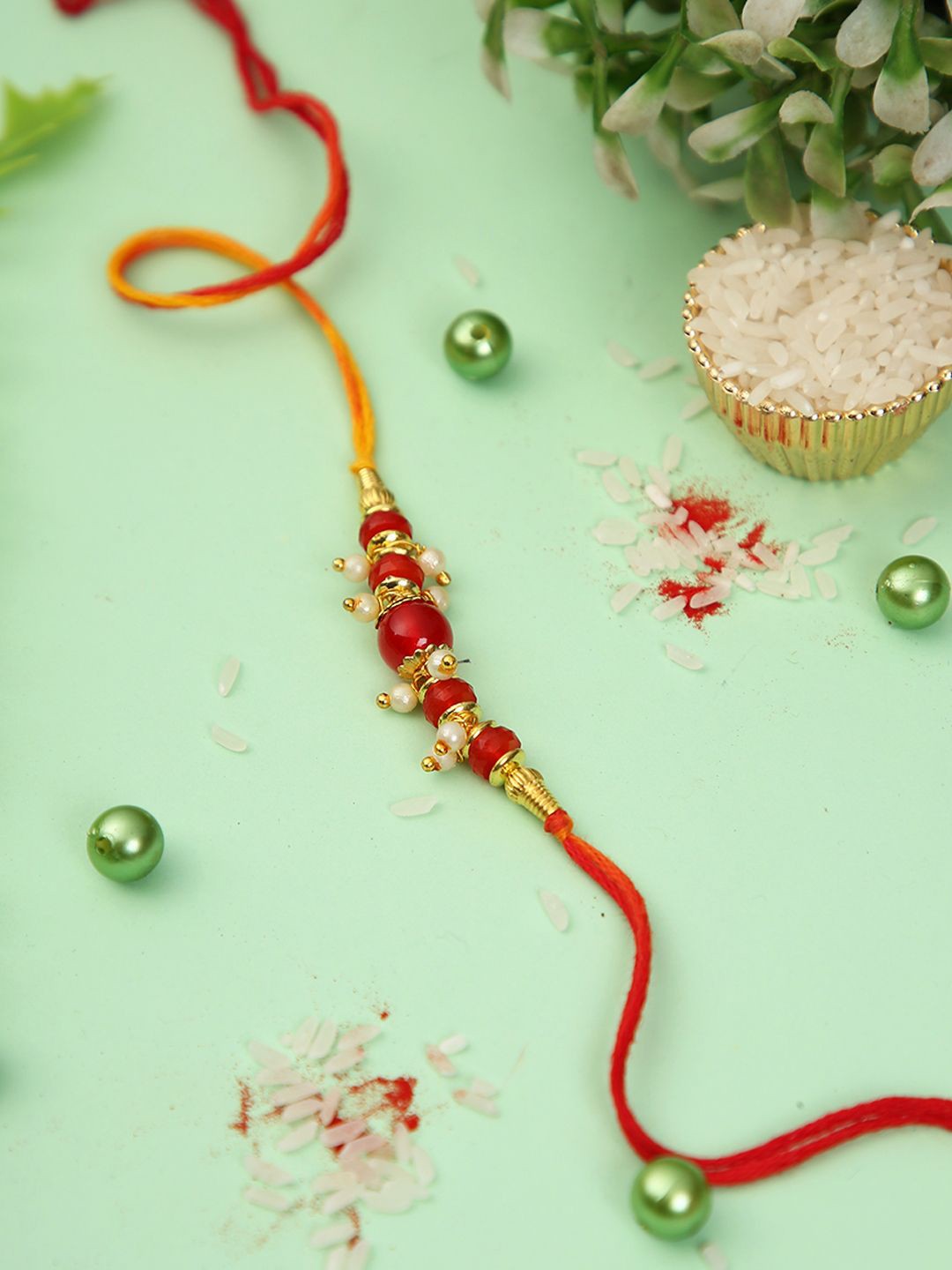 

Aapno Rajasthan Beaded Rakhi With Roli Chawal & Greeting Card, Red