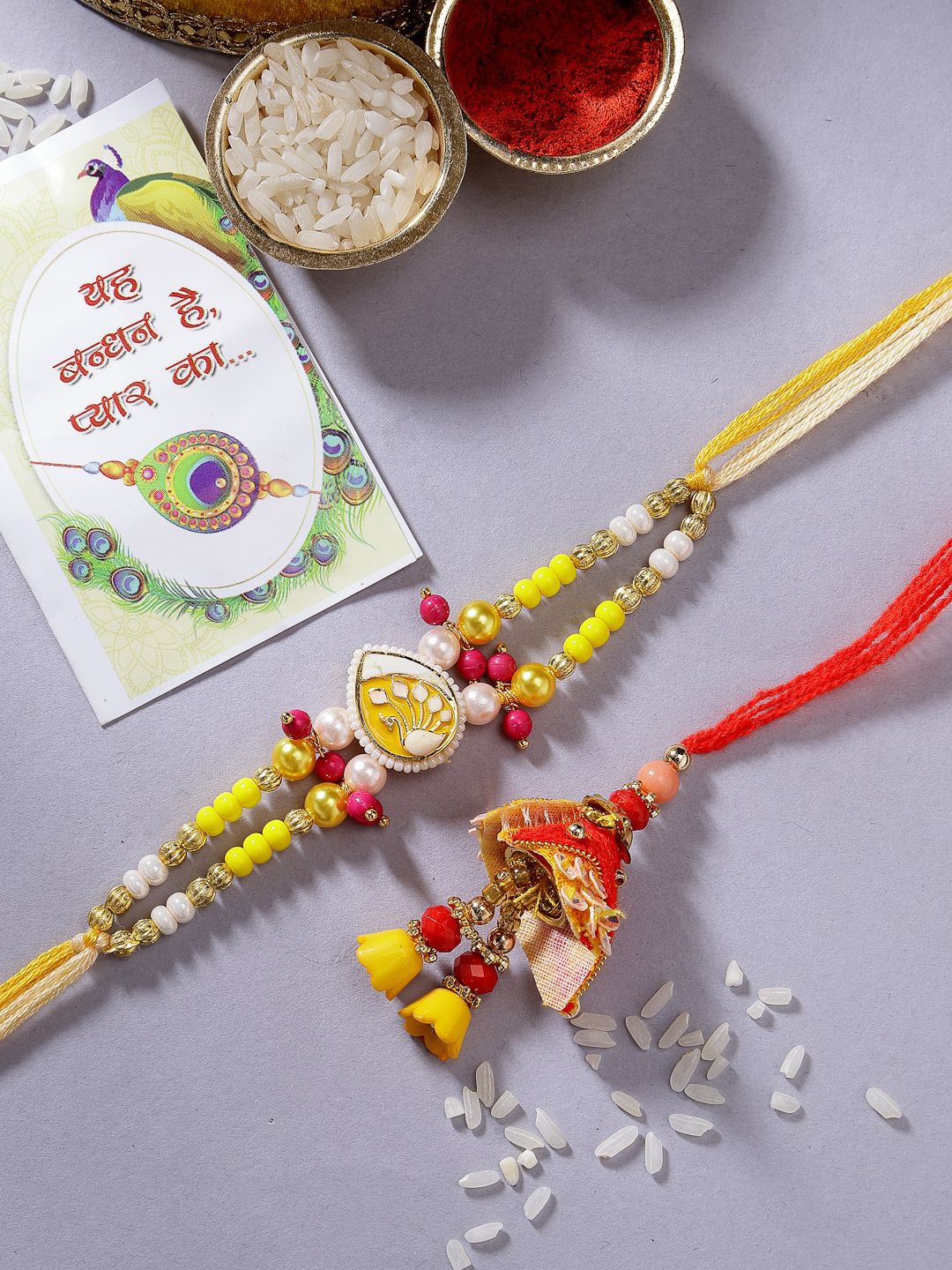 

NVR Set of 2 Yellow Peacock Design Bhaiya Bhabhi Rakhi With Chocolates & Roli Chawal