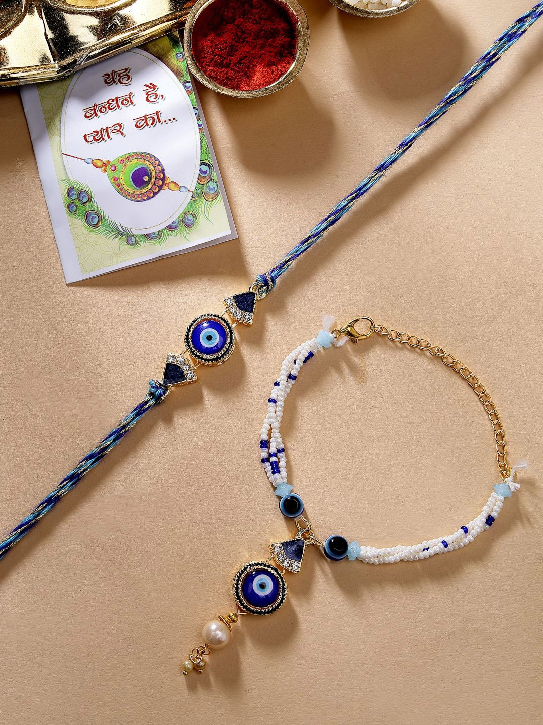 

NVR Set of 2 Evil Eye Bhaiya Bhabhi Rakhi With Chocolate & Roli Chawal, Blue