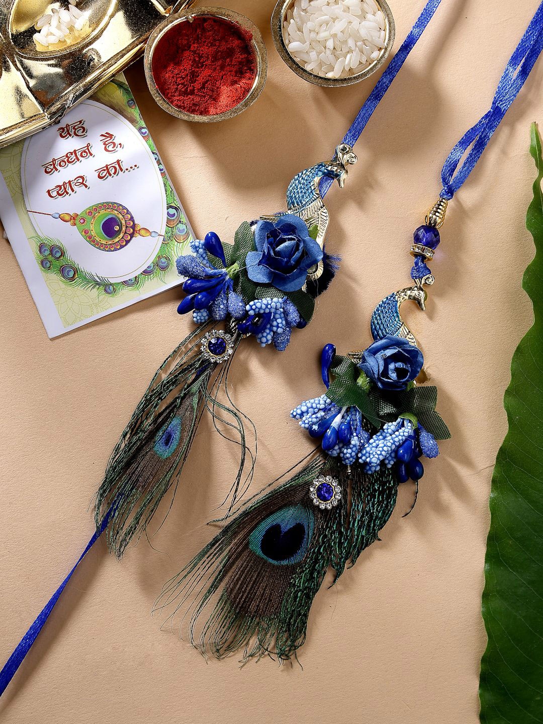 

NVR Set of 2 Peacock Design Bhaiya Bhabhi Rakhi With Chocolate & Roli Chawal, Blue