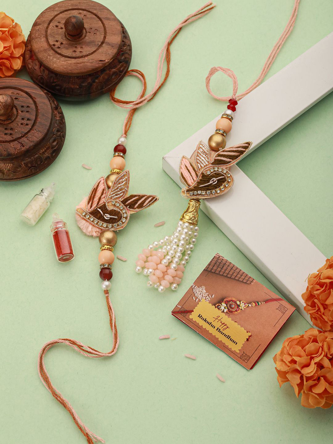 

Saraf RS Jewellery Set Of 2 Designer Zardozi Lumba Rakhis with Roli Chawal & Greeting Card, Gold